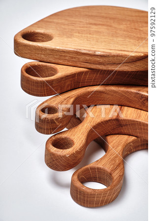 different kind of handmade oak chopping board on white background different kind of handmade oak chopping board on white background 97592129