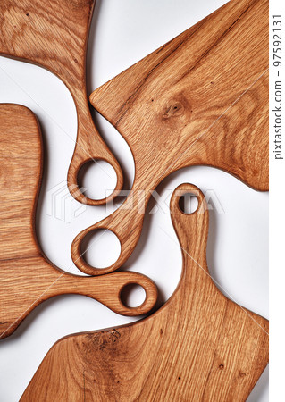 different kind of handmade oak chopping board on white background different kind of handmade oak chopping board on white background 97592131