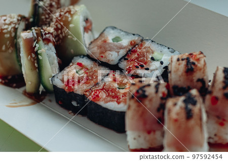 Beautiful delicious sushi. Sushi delivery Beautiful delicious sushi. Sushi delivery 97592454