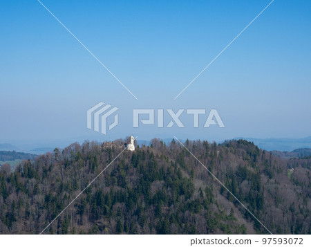 Thurgau, Switzerland - March 27th 2022: The castle Iddaburg, situated on ahill surrounded by forests. 97593072