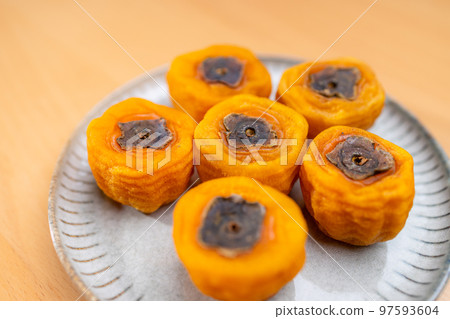 Dried persimmon on the plate Dried persimmon on the plate 97593604