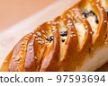 Raisin bread over the wooden board 97593694