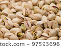 Stack of pistachio nut snack 97593696