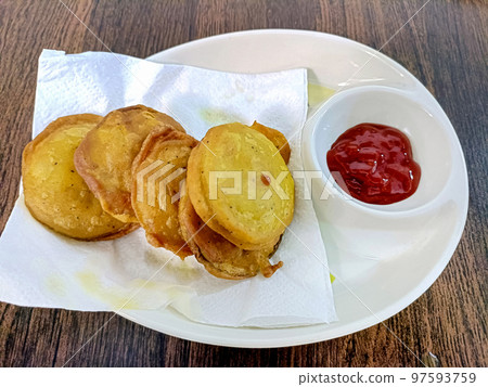 Indian snack pakora with sauce on wooden background with copy space 97593759