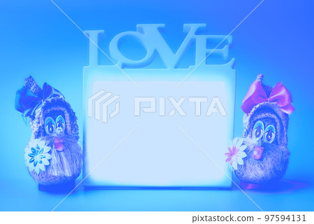 Two funny gnomes and love frame on a blue background 97594131