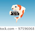 Koi fish taking a photograph using a vintage camera 97596068