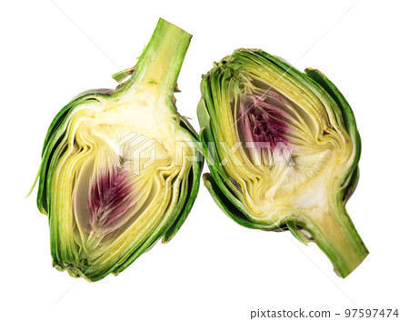 two halves of ripe green artichokes on a white background two halves of ripe green artichokes on a white background 97597474