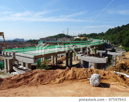 SELANGOR, MALAYSIA -JULY 6, 2022: An elevated road is under construction. Reinforced concrete is used for the structure. Construction is done in stages according to the sequence of works. SELANGOR, MALAYSIA -JULY 6, 2022: An elevated road is under construction. Reinforced concrete is used for the structure. Construction is done in stages according to the sequence of works. 97597643
