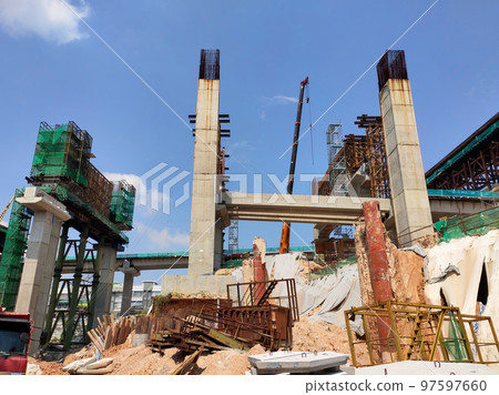 SELANGOR, MALAYSIA -JULY 6, 2022: An elevated road is under construction. Reinforced concrete is used for the structure. Construction is done in stages according to the sequence of works. SELANGOR, MALAYSIA -JULY 6, 2022: An elevated road is under construction. Reinforced concrete is used for the structure. Construction is done in stages according to the sequence of works. 97597660