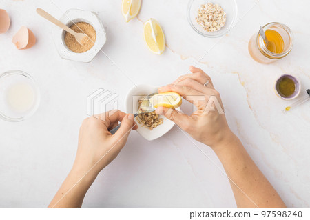 Flatlay with homemade beauty products: fresh ingredients like oat, honey, lemon, banana, egg, olive Flatlay with homemade beauty products: fresh ingredients like oat, honey, lemon, banana, egg, olive 97598240
