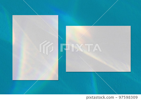 Two empty rectangle poster mockups on blue background Two empty rectangle poster mockups on blue background 97598309