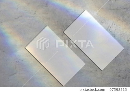 Two empty business card mockups on gray background Two empty business card mockups on gray background 97598313