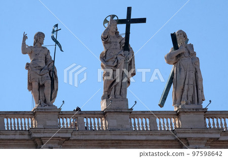 St. John the Baptist, Jesus, St. Andrew, fragment of colonnade of St. Peters Basilica in Vatican, Rome, Italy 97598642