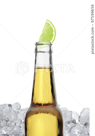 Mexican beer bottle with lime slice and frost on white background Mexican beer bottle with lime slice and frost on white background 97599656