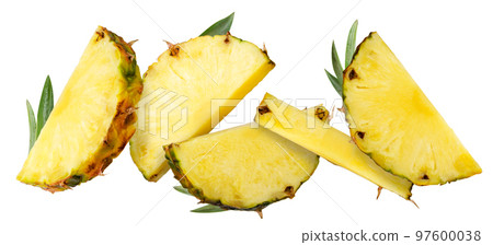 Pieces of pineapple with leaves fly on a white. Isolated Pieces of pineapple with leaves fly on a white. Isolated 97600038