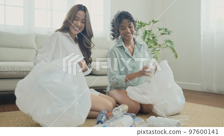Nature conservation concept of 4k Resolution. Asian women collecting garbage together in the house. Roommates are doing activities in harmony. Nature conservation concept of 4k Resolution. Asian women collecting garbage together in the house. Roommates are doing activities in harmony. 97600141