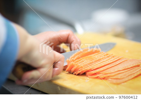 close up. chef slicing fish for sushi close up. chef slicing fish for sushi 97600412