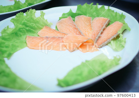 dishes with red fish on the table in the kitchen of the restaurant dishes with red fish on the table in the kitchen of the restaurant 97600413