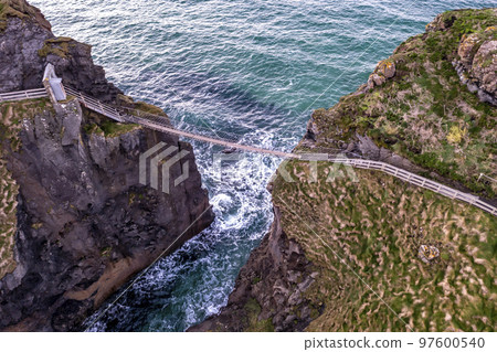 The Carrick-a-Rede Rope Bridge, near Ballintoy in County Antrim. Linking mainland the island of Carrickarede. Nothern Ireland, UK The Carrick-a-Rede Rope Bridge, near Ballintoy in County Antrim. Linking mainland the island of Carrickarede. Nothern Ireland, UK 97600540