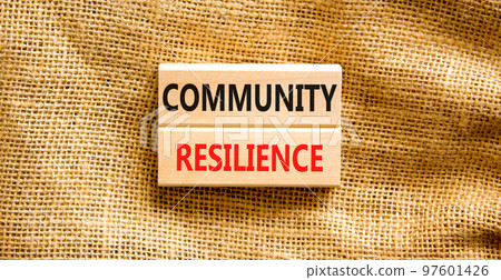 Community resilience symbol. Concept word Community resilience typed on wooden blocks. Beautiful canvas table canvas background. Business and community resilience concept. Copy space. 97601426