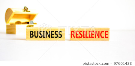 Business resilience symbol. Concept word Business resilience typed on wooden blocks. Beautiful white table white background. Wooden chest with coins. Business business resilience concept. Copy space. Business resilience symbol. Concept word Business resilience typed on wooden blocks. Beautiful white table white background. Wooden chest with coins. Business business resilience concept. Copy space. 97601428
