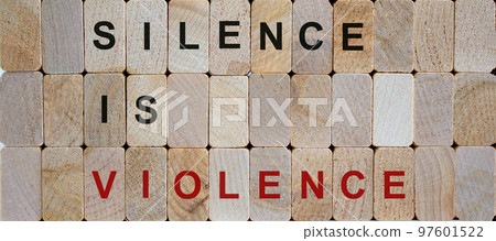 Wooden blocks form the words 'silence is violence'. Beautiful wooden background. Concept image. 97601522