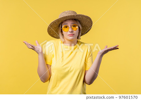 Confused pretty woman, shoulders up - can't help, makes gesture of I dont know. Difficult question 97601570