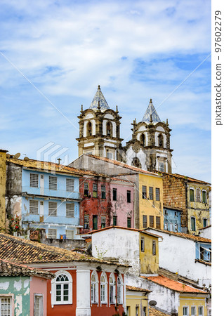 Historic church tower between the roofs and facades of houses in the Pelourinho Historic church tower between the roofs and facades of houses in the Pelourinho 97602279