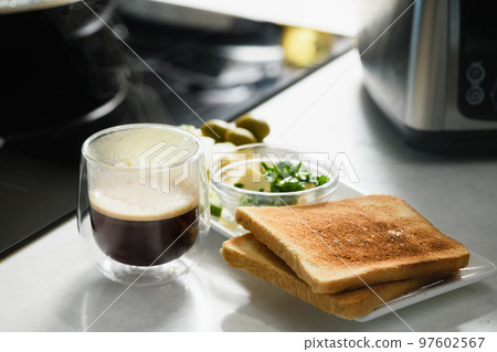 Two toast with sliced avocado, butter, cheese for a healthy sandwich. 97602567