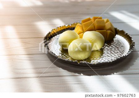 Tasty dessert Mochi with mango fruit on wooden background Tasty dessert Mochi with mango fruit on wooden background 97602763