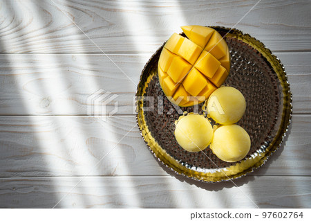 Tasty dessert Mochi with mango fruit on wooden background Tasty dessert Mochi with mango fruit on wooden background 97602764
