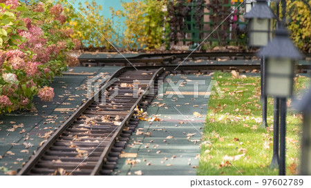 Outdoor railway attraction with lamp lanterns Outdoor railway attraction with lamp lanterns 97602789