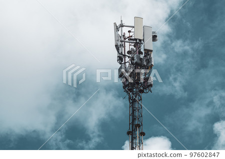 Cellular network tower with antennas in clouds Cellular network tower with antennas in clouds 97602847