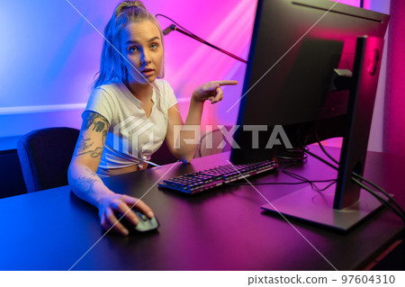 Professional esport gamer girl streaming and losing online video game on PC 97604310