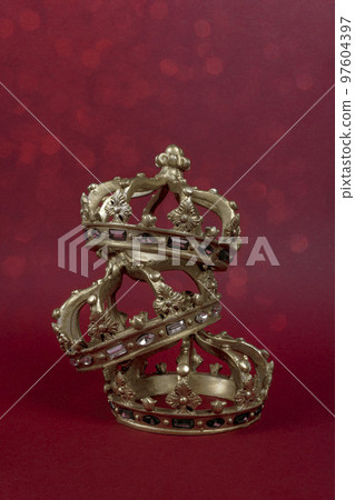 Happy Three King's Day. Three gold crowns on red background. Concept for Reyes Magos, Three Wise Men or Happy Epiphany day. 97604397