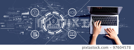 Cyber security theme with person using a laptop 97604578