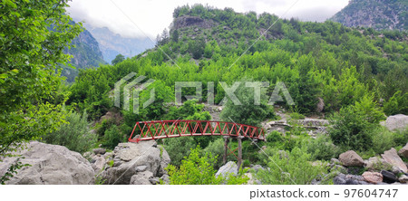 Crossing over river on the Grunasit waterfall trail, Theth, Albania 97604747
