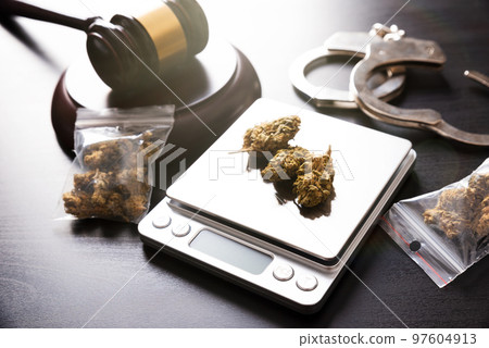 Drug package with hemp. Marijuana bags on scale Drug package with hemp. Marijuana bags on scale 97604913
