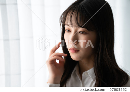 A woman with an ennui atmosphere 97605362