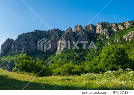 The top of the mountain, covered with greenery. The top of the mountain, covered with greenery. 97607324