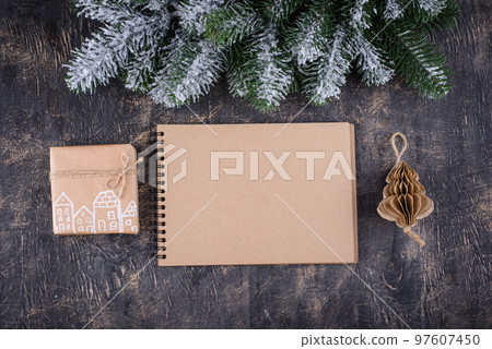 Christmas composition with empty craft notebook Christmas composition with empty craft notebook 97607450
