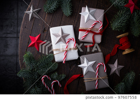 Christmas gift box with candy and star. 97607558