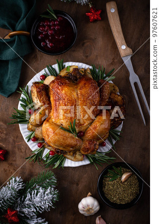 Christmas baked chicken for festive dinner. Christmas baked chicken for festive dinner. 97607621
