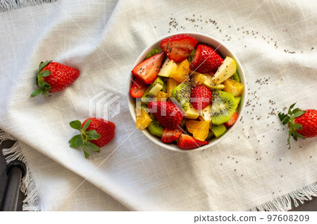 Bowl of healthy fresh fruit salad on white background. Top view Bowl of healthy fresh fruit salad on white background. Top view 97608209