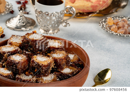 Cup of coffee and turkish pastries on dark surface 97608456