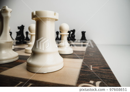 Macro photo of chess pieces on a chess board 97608651
