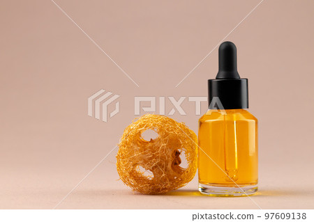Beauty oil bottle with pipette on beige background 97609138
