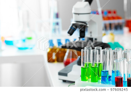 Scientific healthcare research background with microscope in medical laboratory Scientific healthcare research background with microscope in medical laboratory 97609245