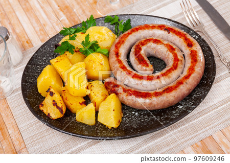 Spanish pork sausages butifarras with potatoes Spanish pork sausages butifarras with potatoes 97609246