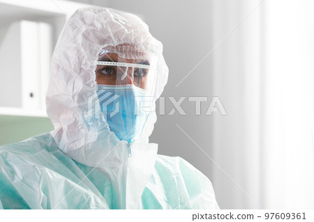 Male doctor in protective medical uniform in clinic Male doctor in protective medical uniform in clinic 97609361